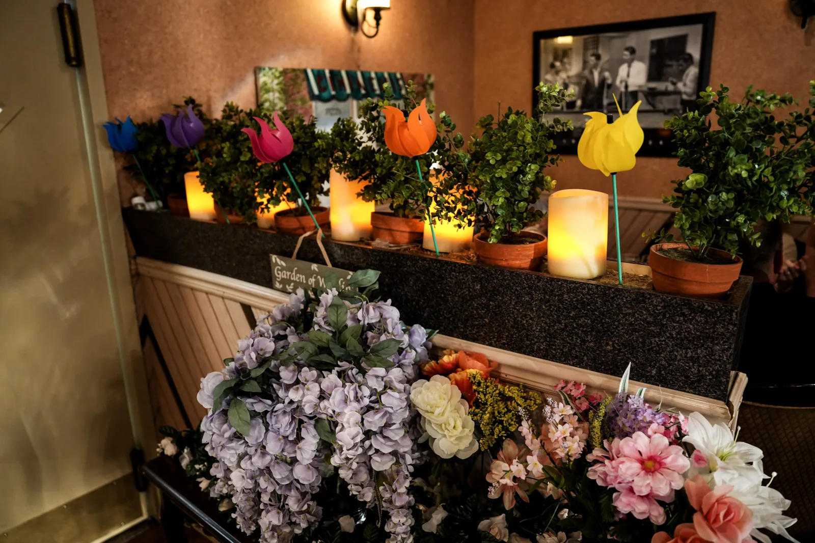 Warm dining room decor with flowers at Ciminelli's Pizzeria Bethpage